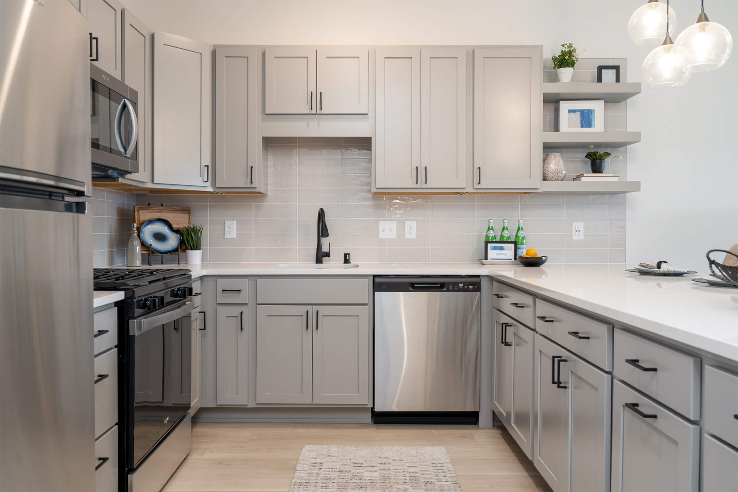 Modern kitchen with gray cabinets and stainless steel