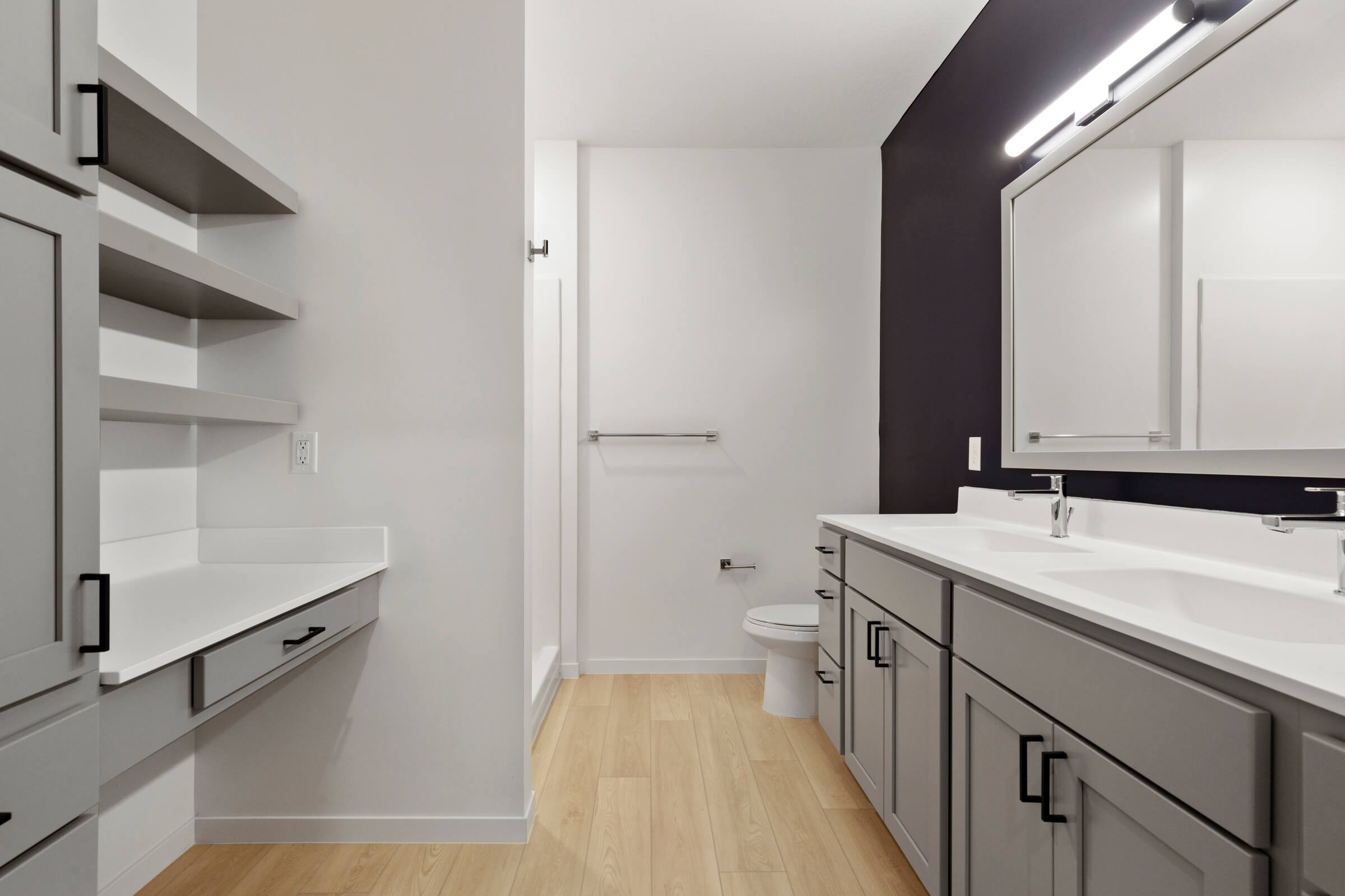 Bathroom with dual sinks and vanity area