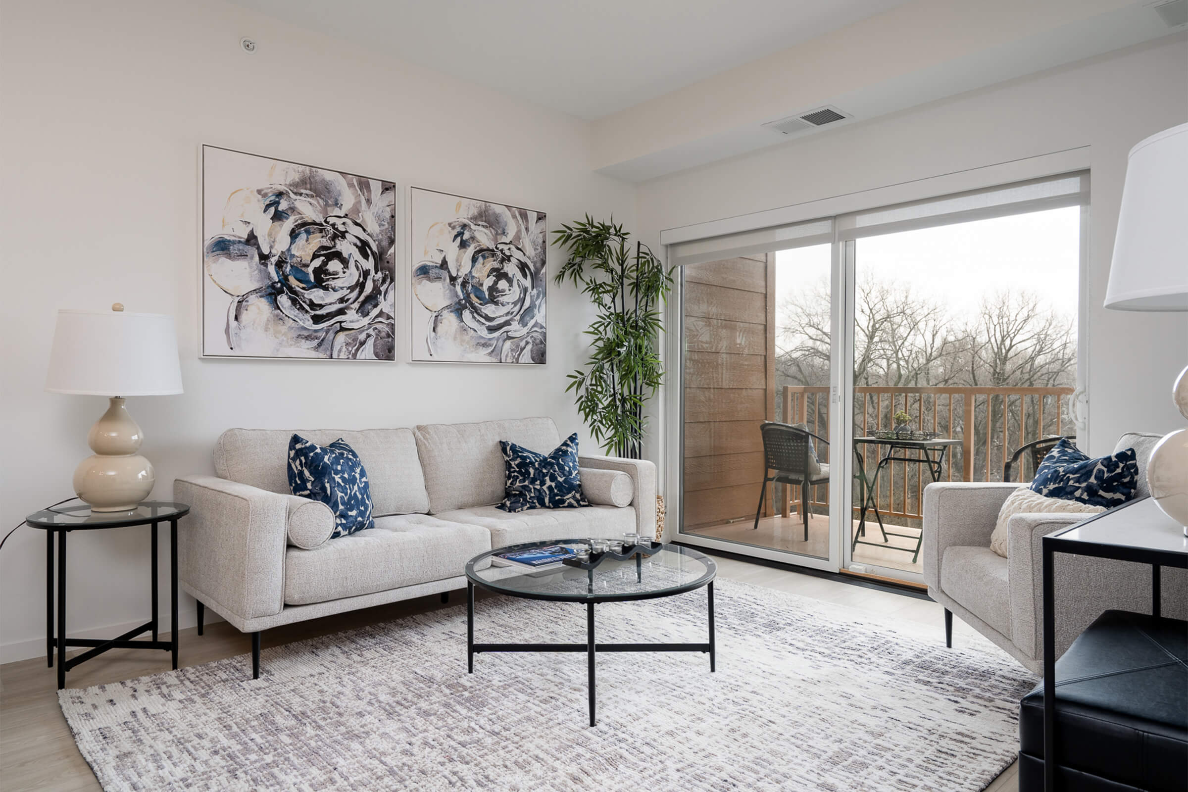 Living room with light sofa and balcony view
