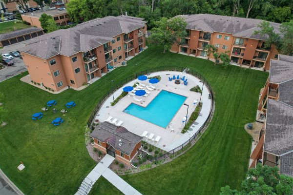 Courtyard at Ballantrae Apartments with trees and walking paths