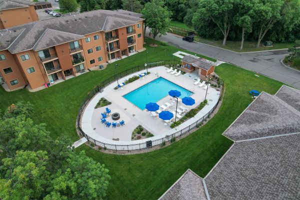 Angle view of pool with chairs and umbrellas