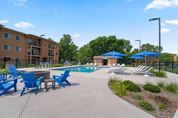Outdoor firepit lounge area near pool at Ballantrae Apartments