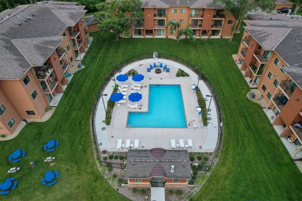 Overhead view of outdoor pool, patio, and lounge seating