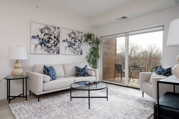 Living room with light sofa and balcony view